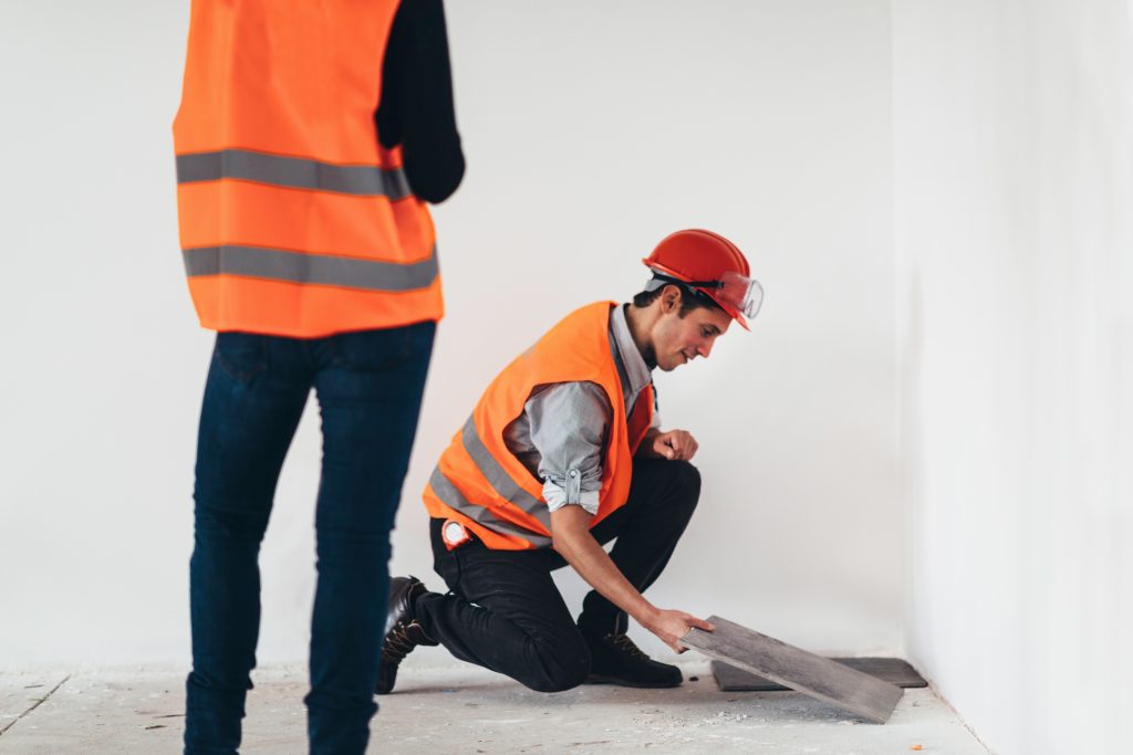 Maintenance Engineering on construction site placing tiles